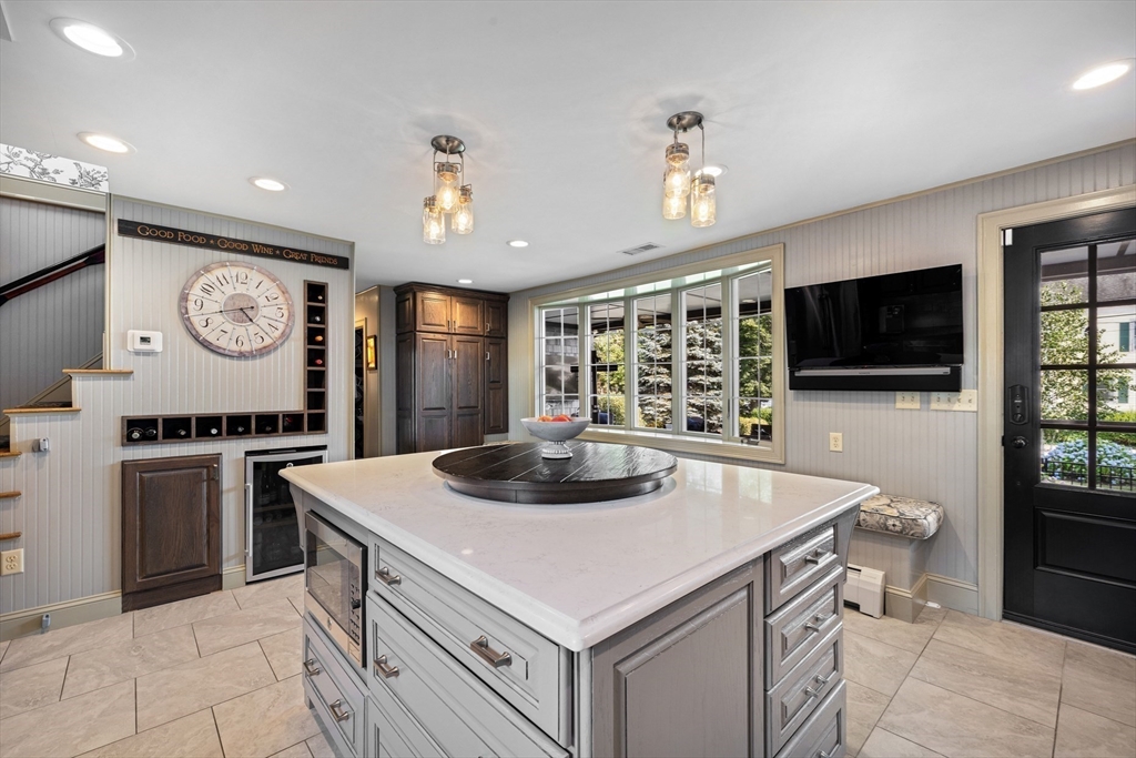 10 Cherry Street Fairhaven, MA 02719 - Photo 14 of 38 a kitchen with a stove a refrigerator and a fireplace
