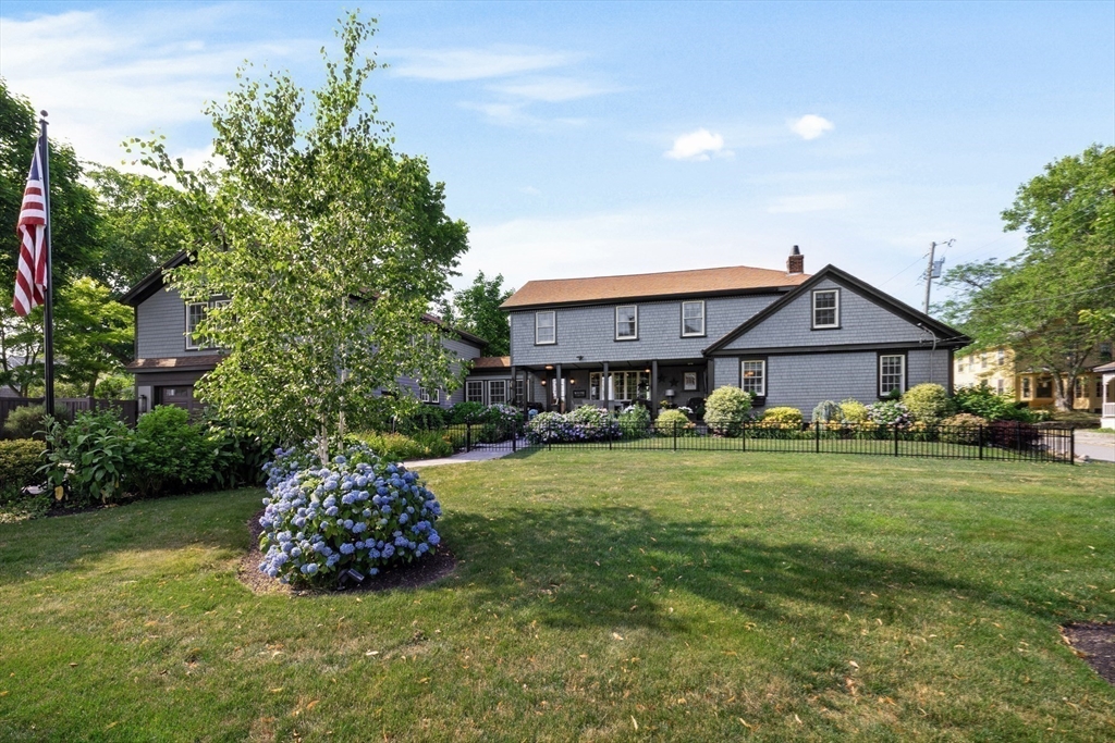 10 Cherry Street Fairhaven, MA 02719 - Photo 16 of 38 a front view of a house with a garden and yard