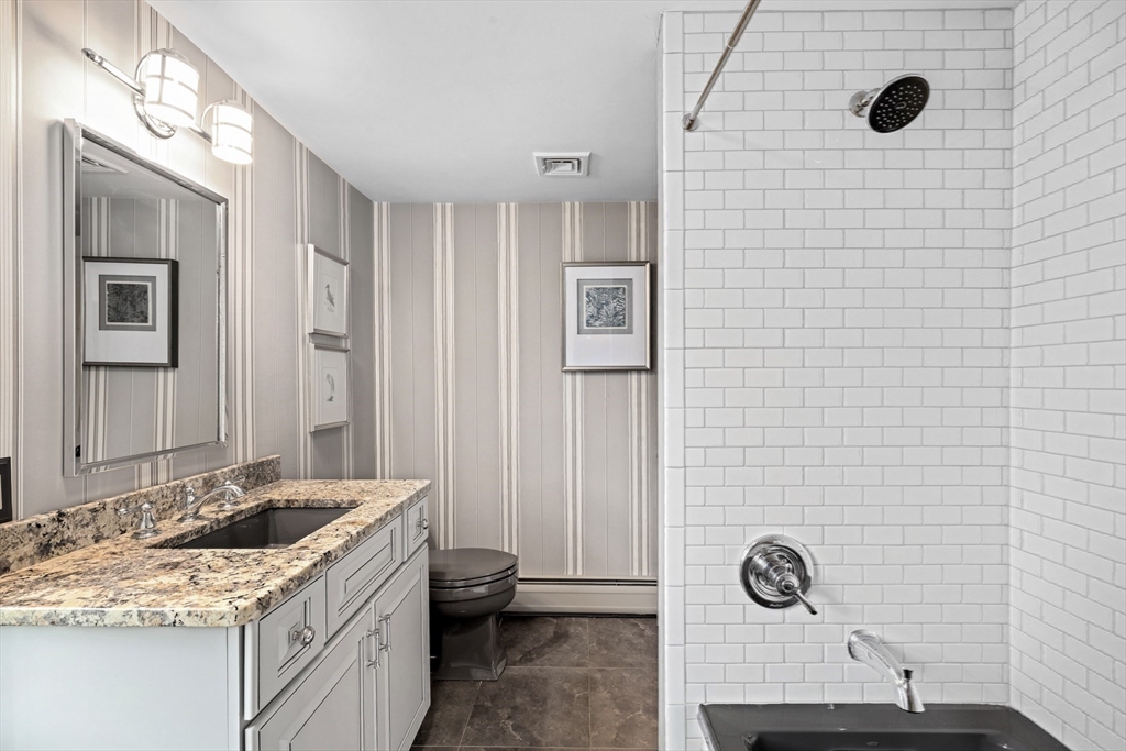 10 Cherry Street Fairhaven, MA 02719 - Photo 18 of 38 a bathroom with a sink and a mirror