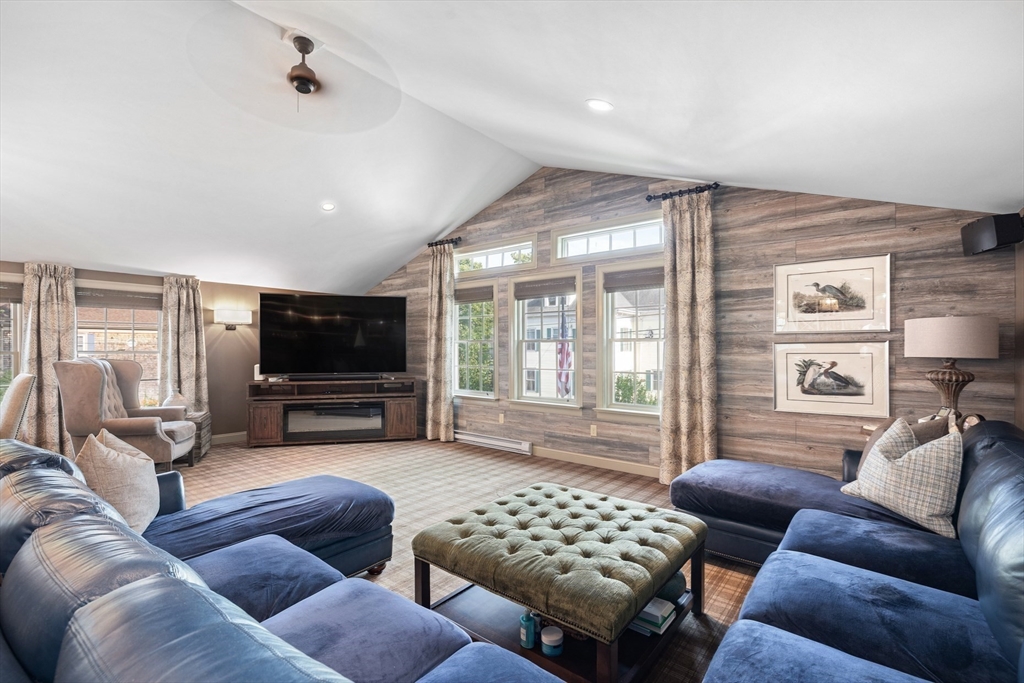 10 Cherry Street Fairhaven, MA 02719 - Photo 23 of 38 a living room with furniture a flat screen tv and a large window