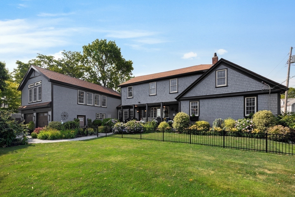10 Cherry Street Fairhaven, MA 02719 - Photo 26 of 38 a front view of a house with a garden