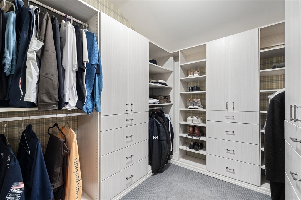 10 Cherry Street Fairhaven, MA 02719 - Photo 28 of 38 a view of walk in closet with clothes and shoes