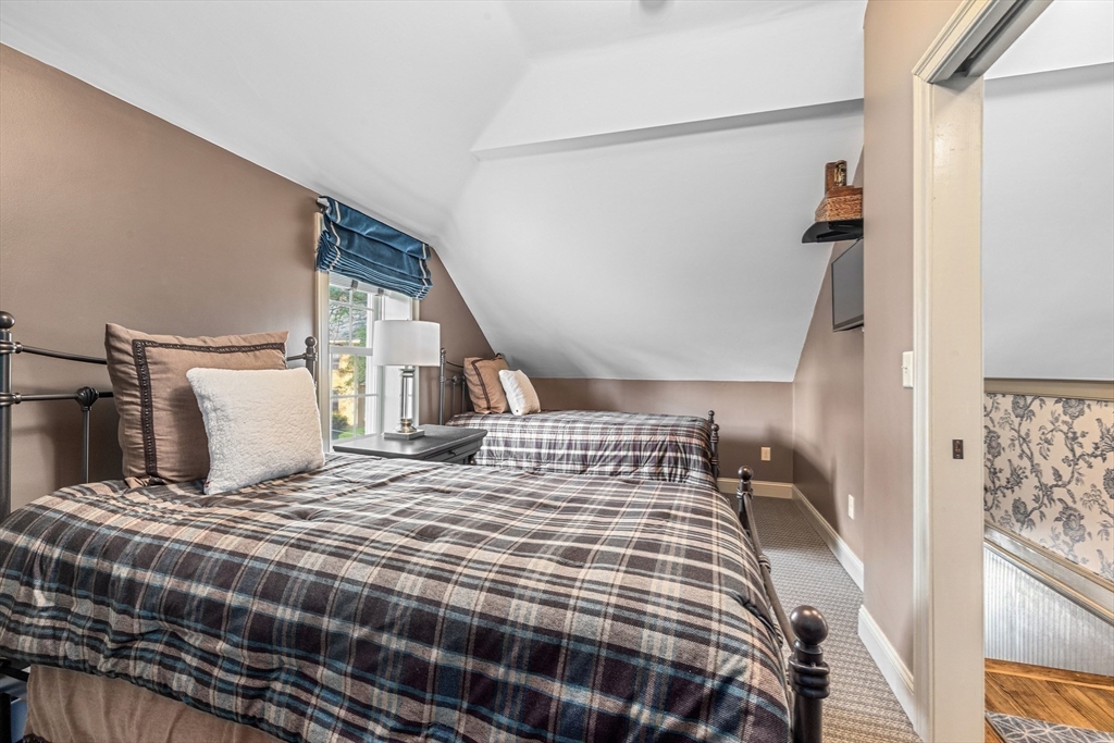 10 Cherry Street Fairhaven, MA 02719 - Photo 32 of 38 a bedroom with a large bed and a lamp with window