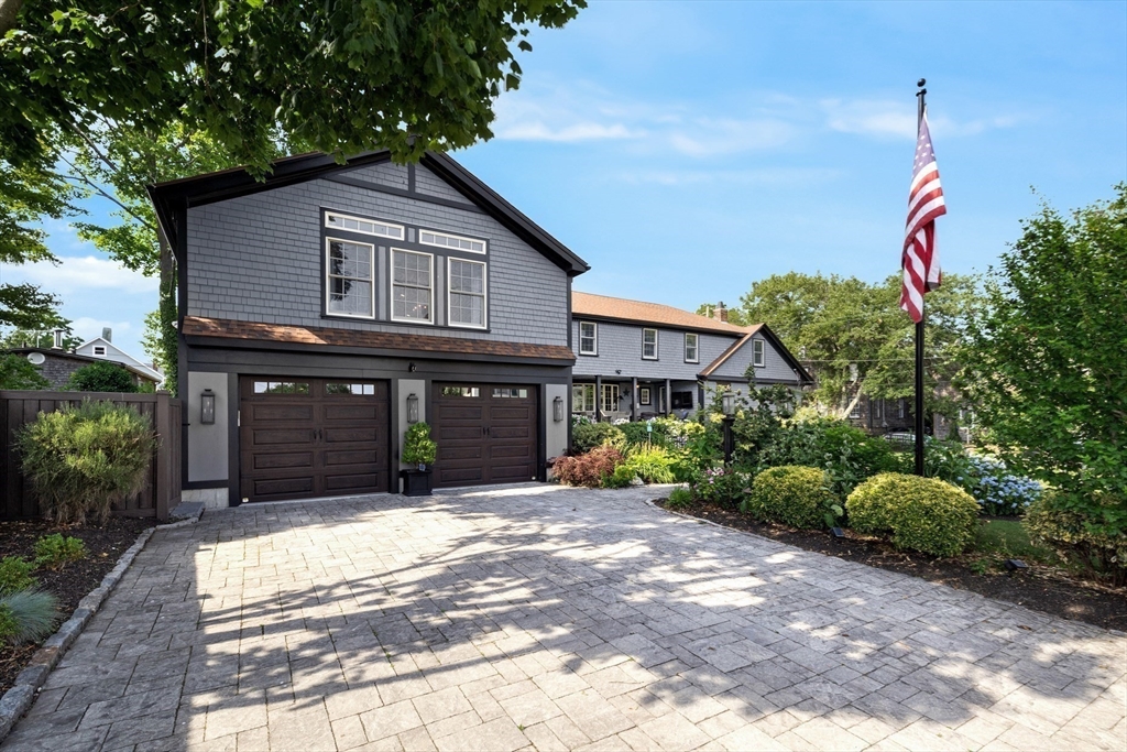 10 Cherry Street Fairhaven, MA 02719 - Photo 9 of 38 a front view of a house with a garden and trees