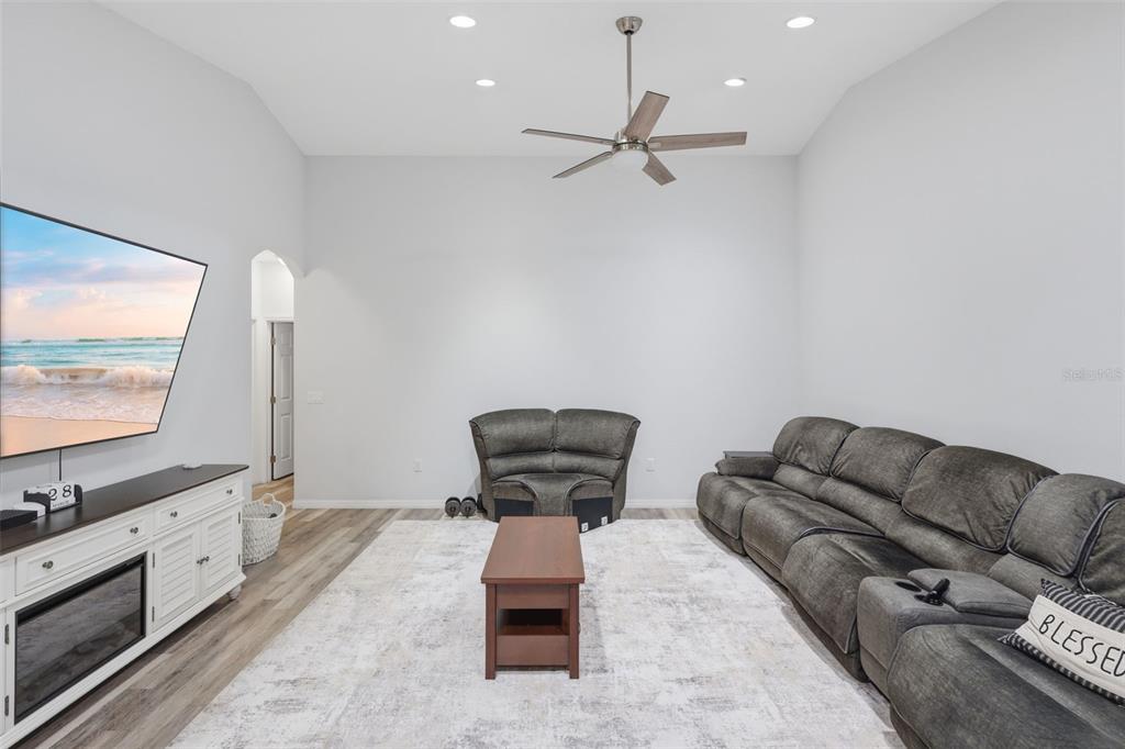 205 Merlot Street DeLand, FL 32724 - Photo 11 of 34 a living room with furniture and a flat screen tv