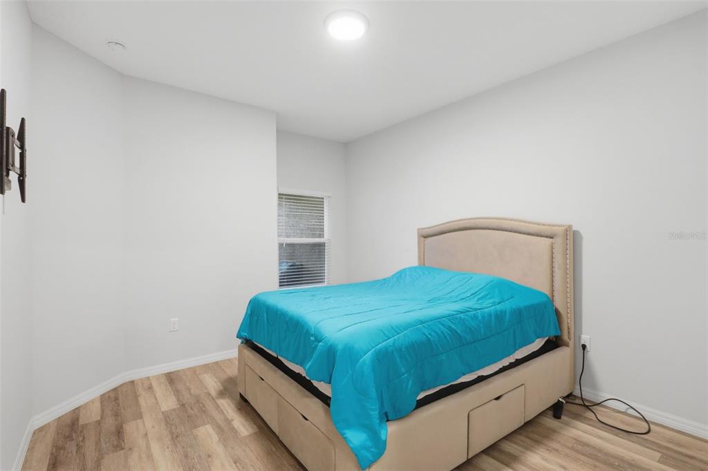 205 Merlot Street DeLand, FL 32724 - Photo 21 of 34 a bedroom with a bed and window