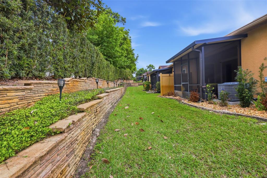 205 Merlot Street DeLand, FL 32724 - Photo 29 of 34 a view of a backyard with large trees