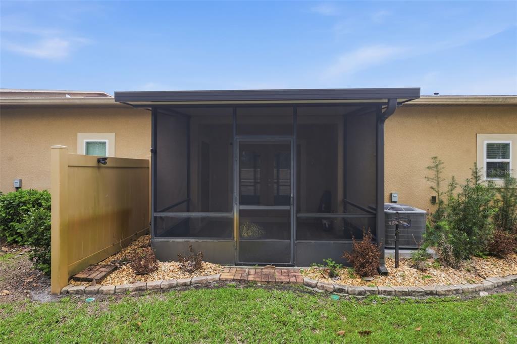 205 Merlot Street DeLand, FL 32724 - Photo 30 of 34 a view of the house with a yard