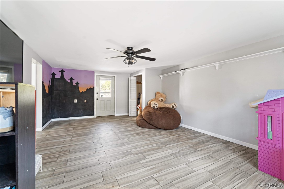 11533 Rolling Brook Road Chester, VA 23831 - Photo 11 of 30 a large room with wooden floor and windows