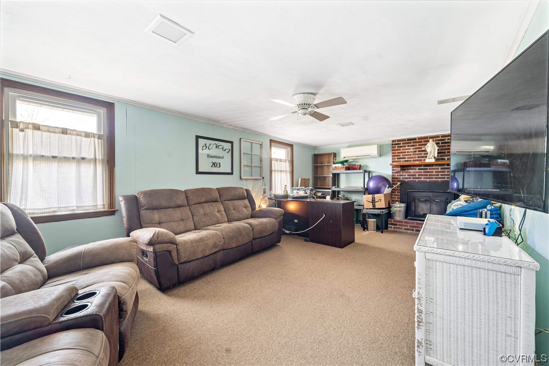 11533 Rolling Brook Road Chester, VA 23831 - Photo 12 of 30 a living room with furniture ceiling fan and a window