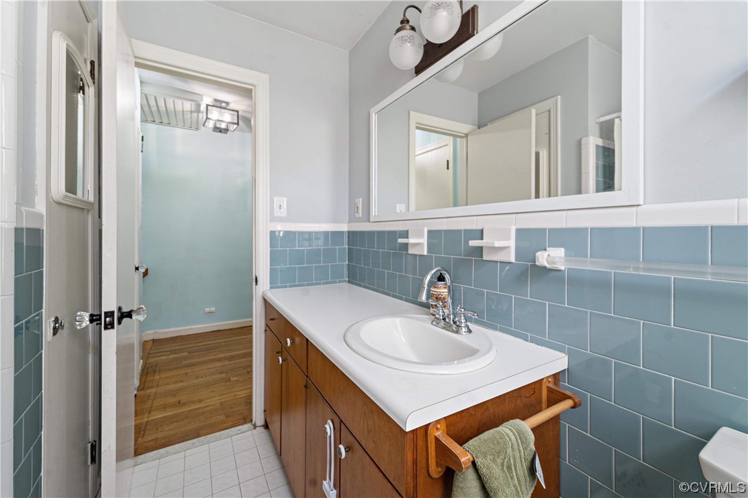 11533 Rolling Brook Road Chester, VA 23831 - Photo 17 of 30 a bathroom with a sink a toilet and shower