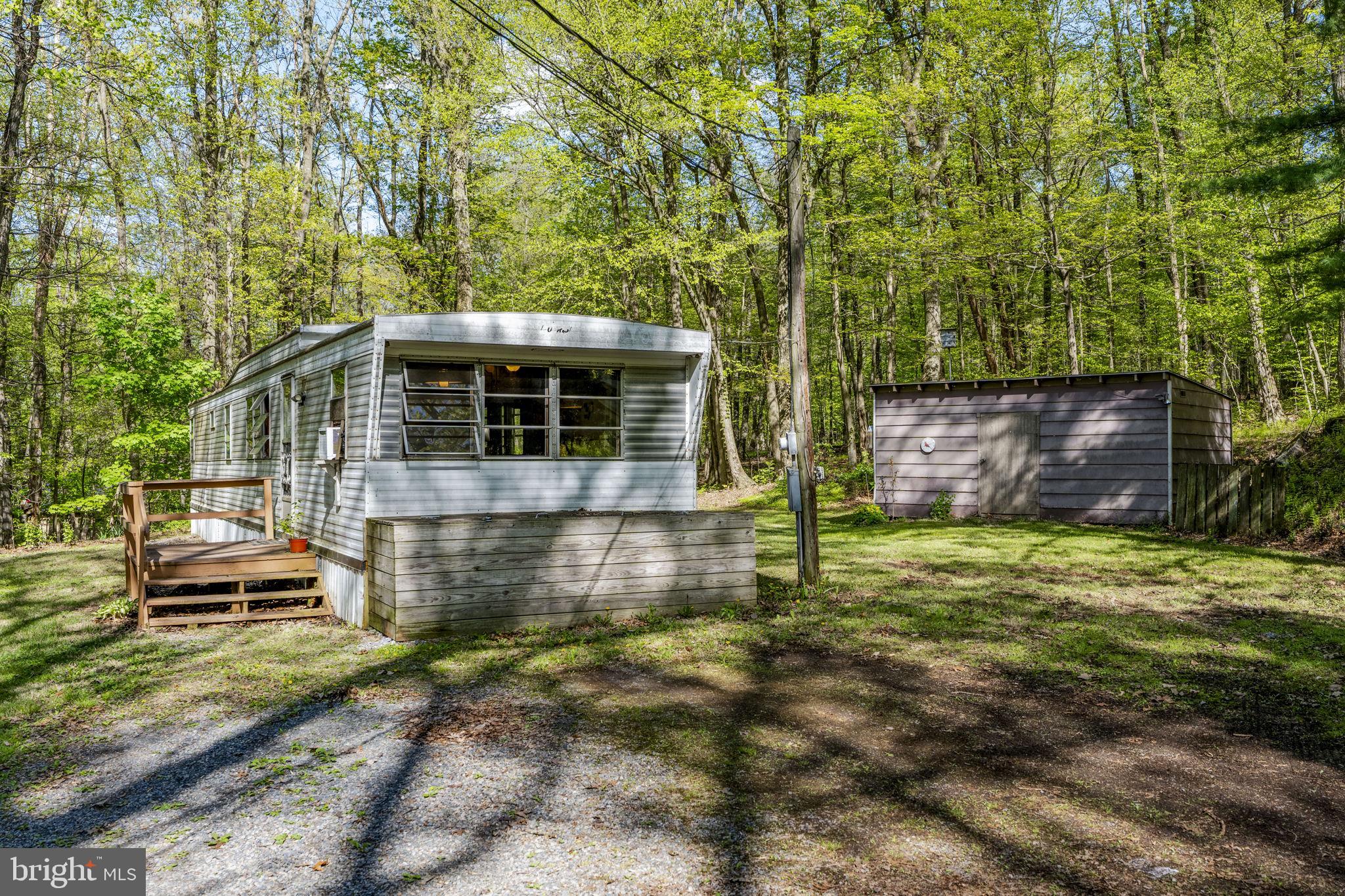 1528 Hilltop Road Mohnton, PA 19540 - Photo 1 of 19 a backyard of a house with lots of green space