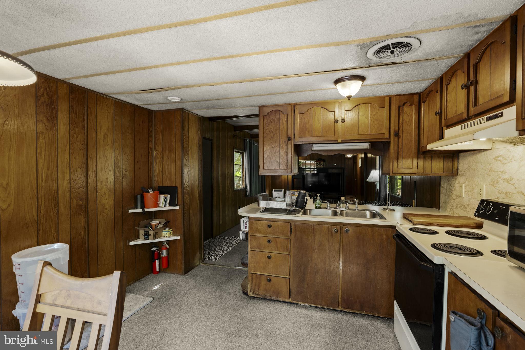 1528 Hilltop Road Mohnton, PA 19540 - Photo 12 of 19 a kitchen with a stove and cabinets