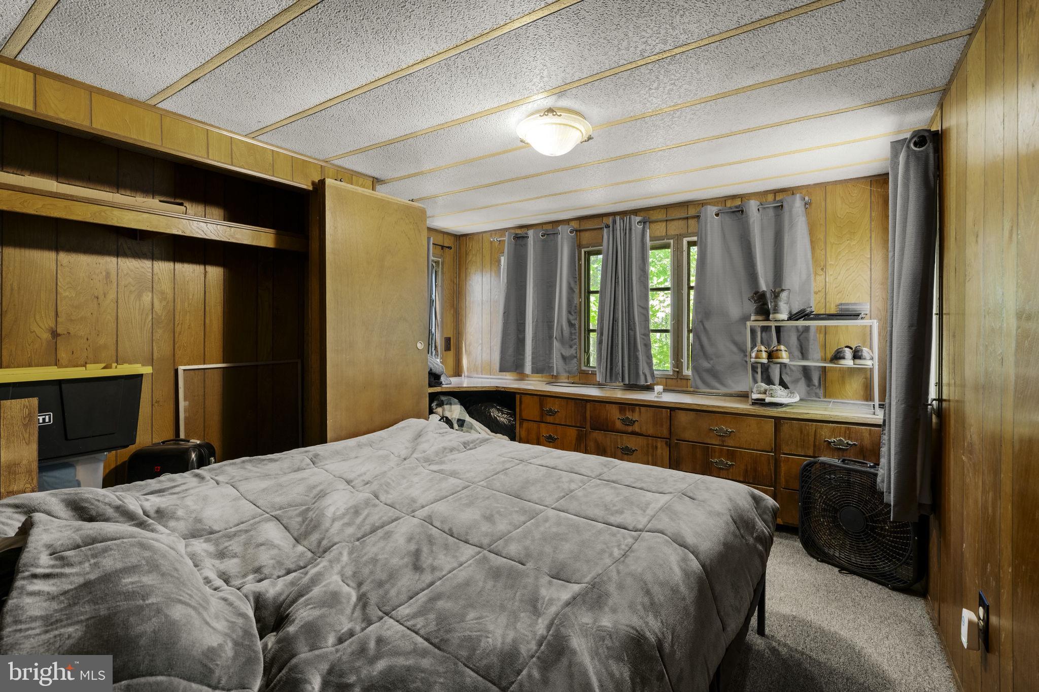 1528 Hilltop Road Mohnton, PA 19540 - Photo 15 of 19 a bedroom with a bed and a large mirror