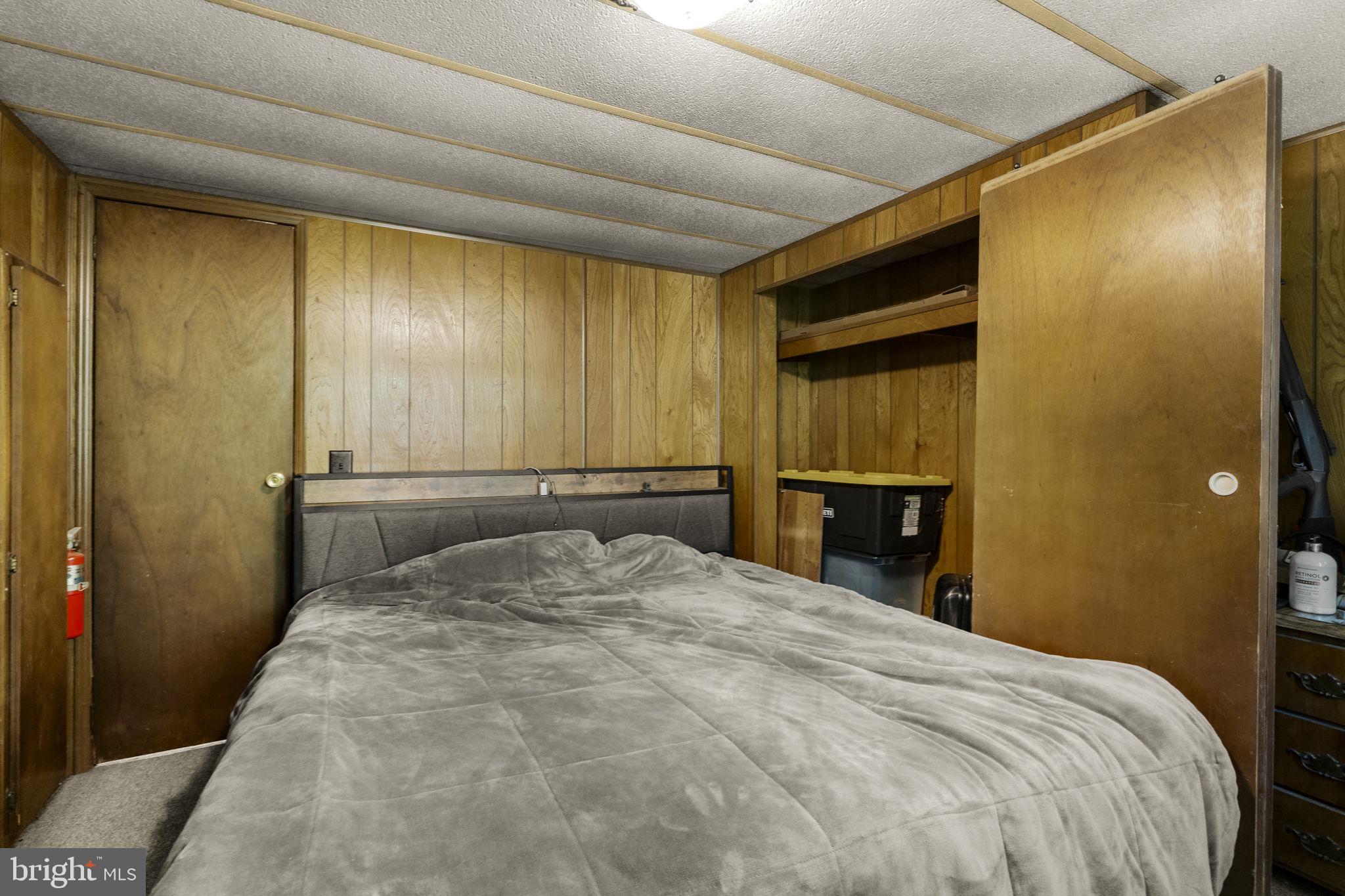 1528 Hilltop Road Mohnton, PA 19540 - Photo 16 of 19 a bedroom with a bed and a mirror