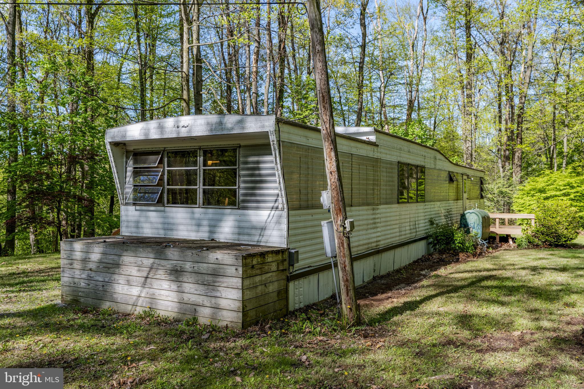 1528 Hilltop Road Mohnton, PA 19540 - Photo 4 of 19 a front view of a house with a yard