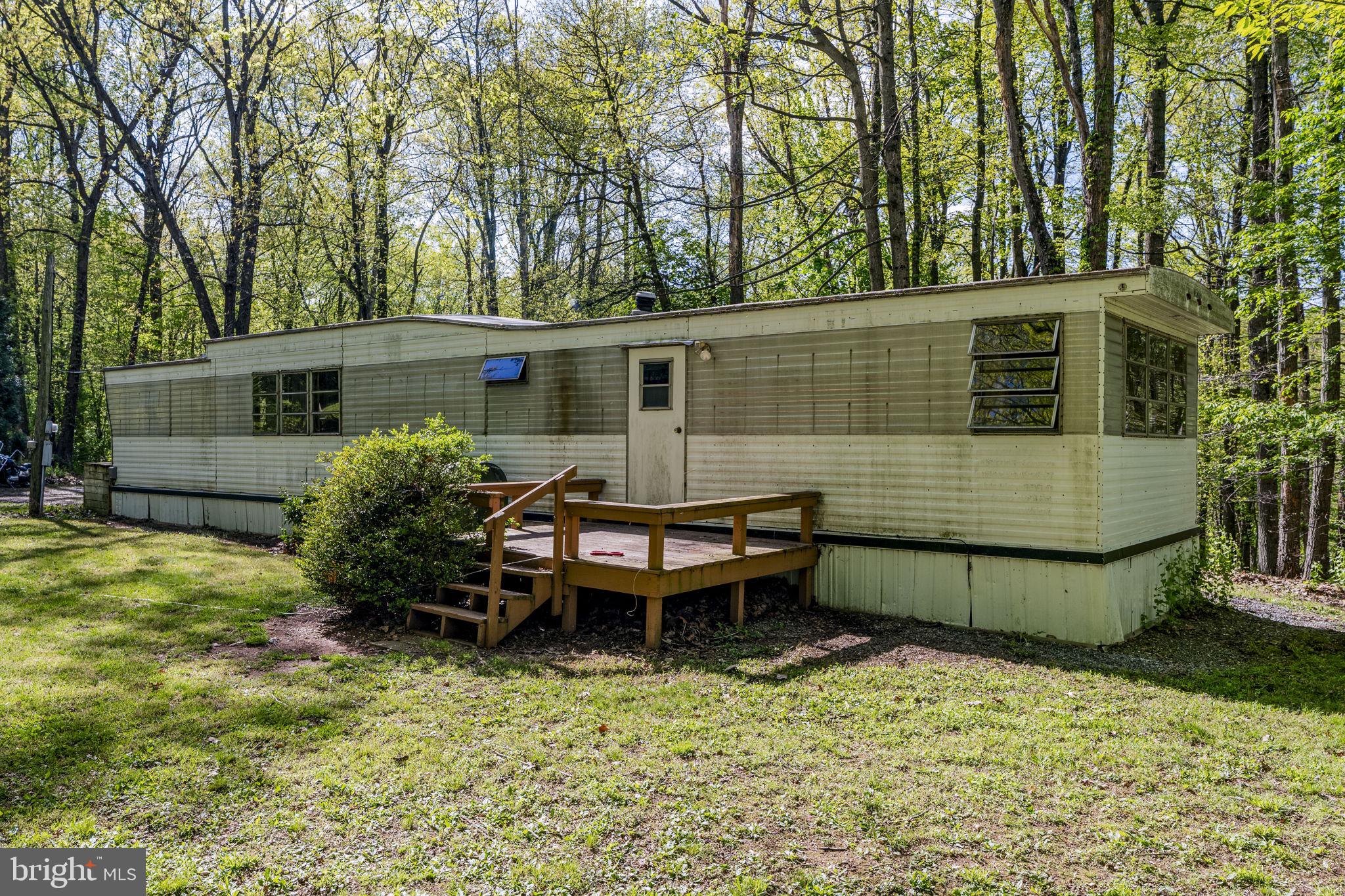 1528 Hilltop Road Mohnton, PA 19540 - Photo 5 of 19 a backyard of a house with yard and outdoor seating