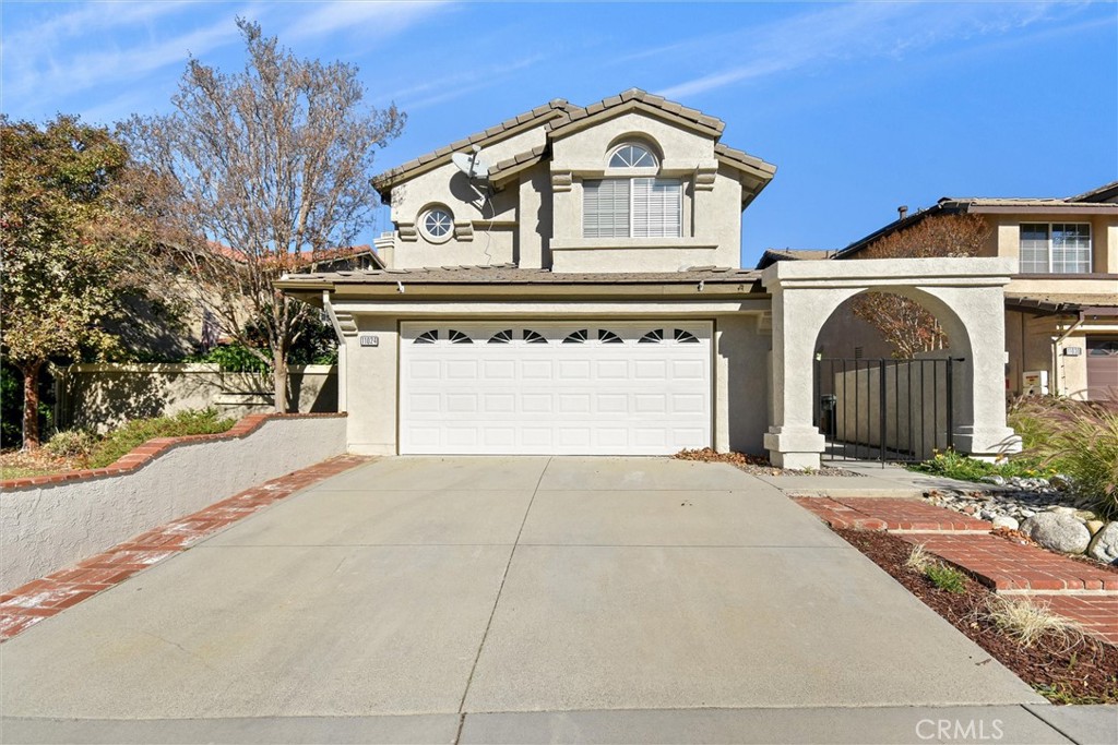 11024 Charleston Street Rancho Cucamonga, CA 91701 - Photo 1 of 30 front view of a house with a yard