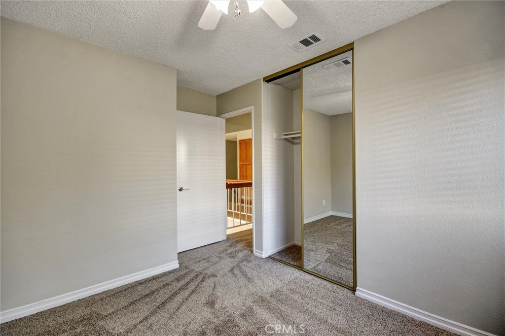 11024 Charleston Street Rancho Cucamonga, CA 91701 - Photo 13 of 30 an empty room with an entryway door