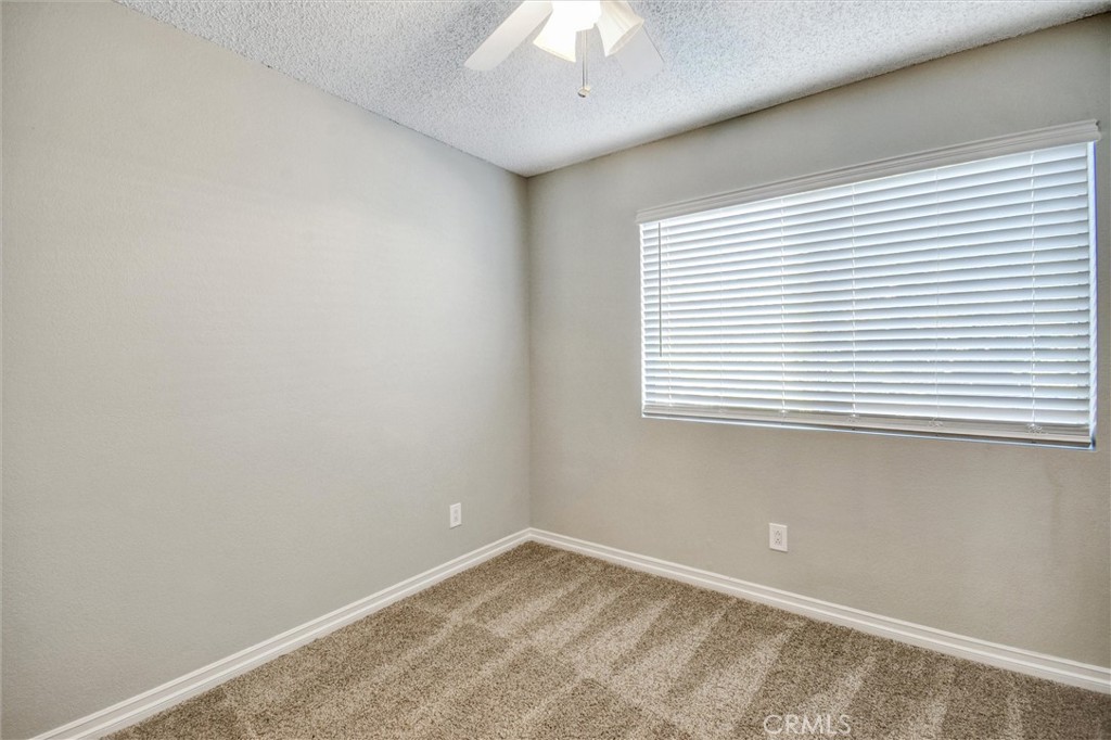 11024 Charleston Street Rancho Cucamonga, CA 91701 - Photo 14 of 30 an empty room with a window