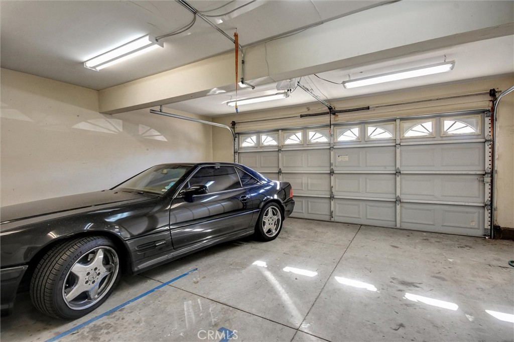 11024 Charleston Street Rancho Cucamonga, CA 91701 - Photo 26 of 30 a car parked in a garage