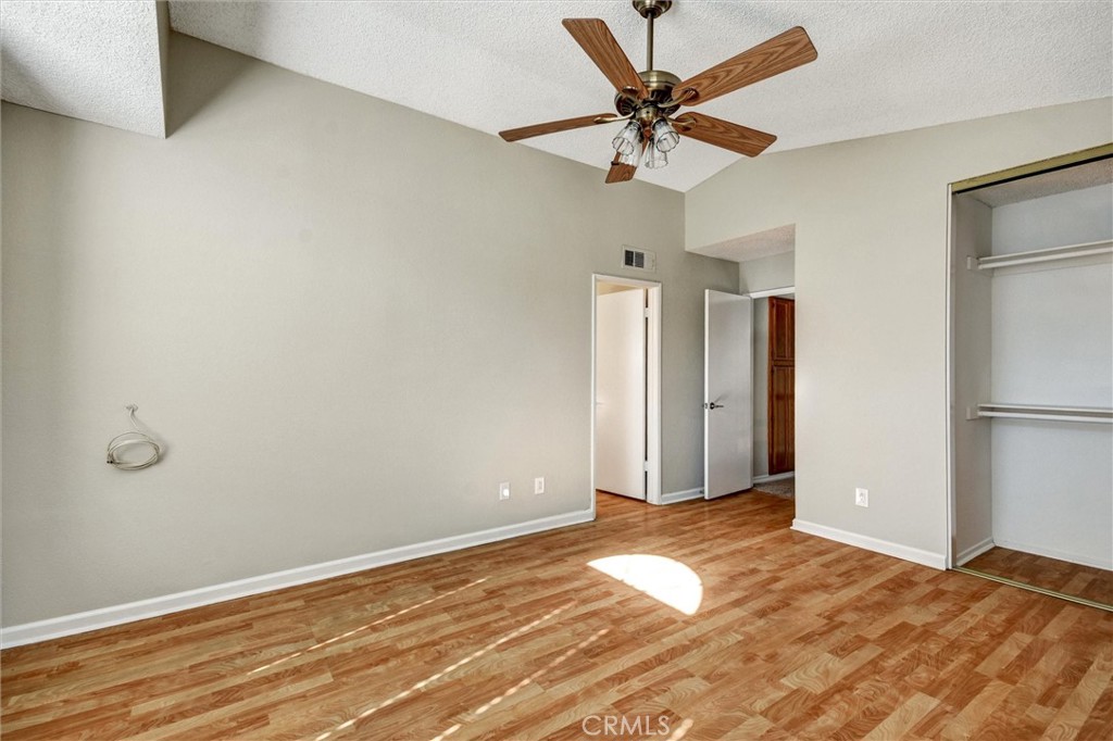11024 Charleston Street Rancho Cucamonga, CA 91701 - Photo 10 of 30 a view of a livingroom with a chandelier fan and wooden floor