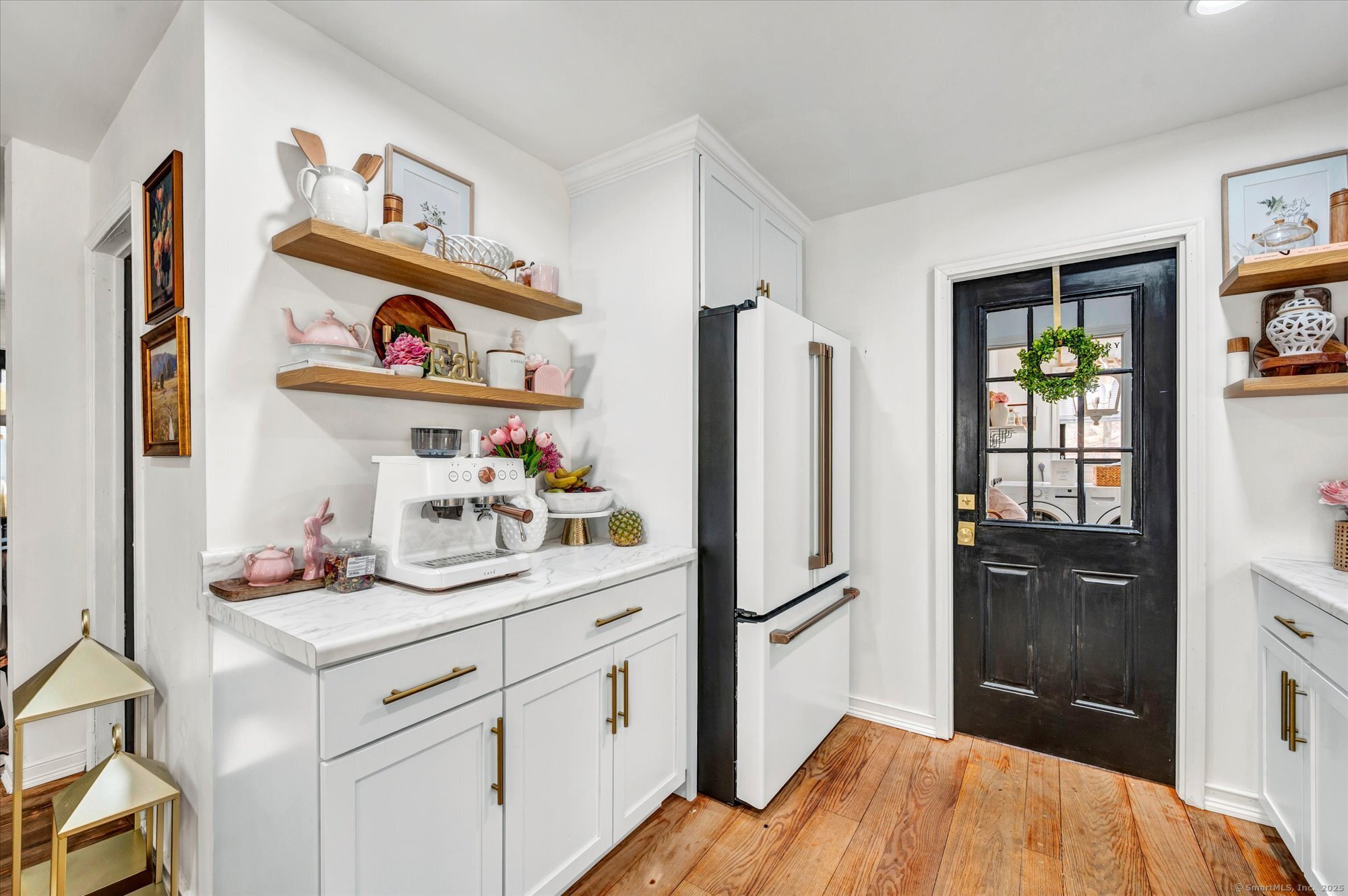 9 Katrina Circle Bethel, CT 06801 - Photo 11 of 25 a kitchen with a refrigerator and cabinets