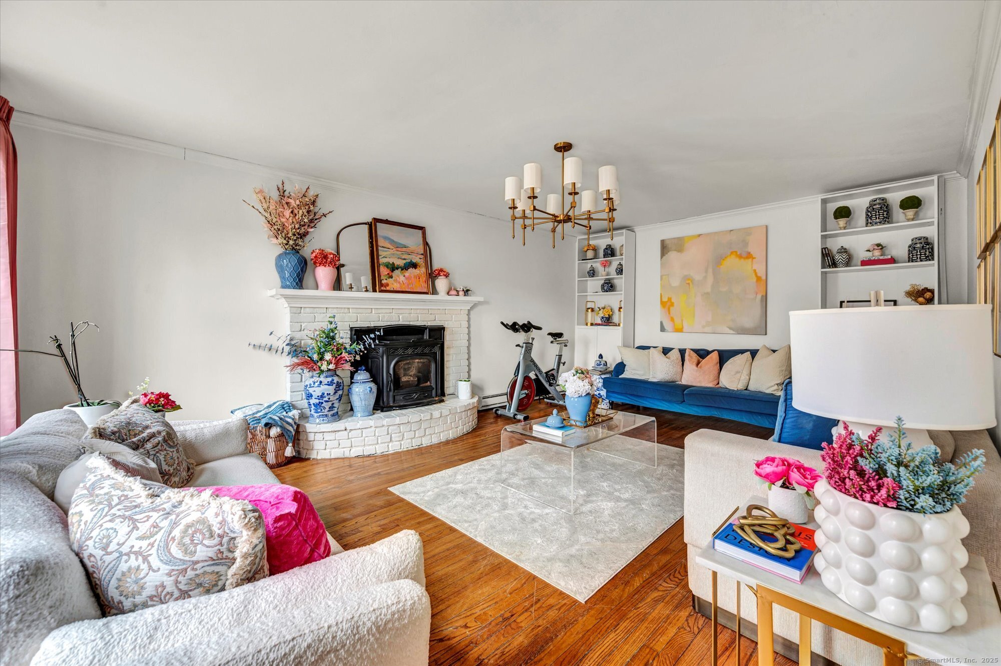 9 Katrina Circle Bethel, CT 06801 - Photo 13 of 25 a living room with furniture and a chandelier