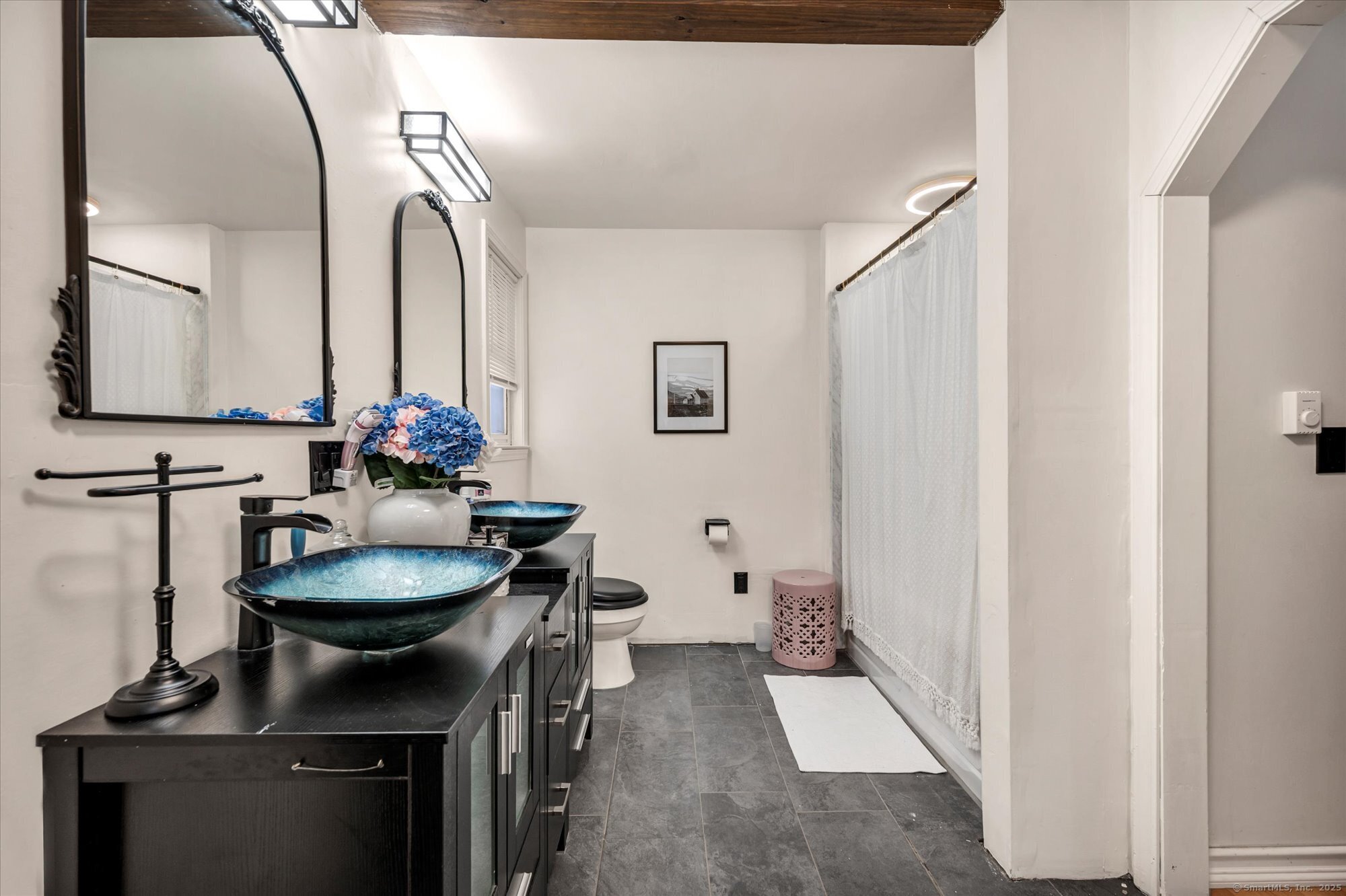 9 Katrina Circle Bethel, CT 06801 - Photo 15 of 25 a bathroom with a sink and a mirror