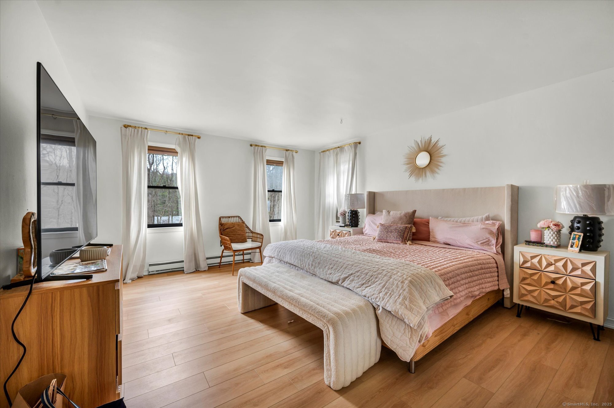 9 Katrina Circle Bethel, CT 06801 - Photo 16 of 25 a bedroom with a bed and wooden floor