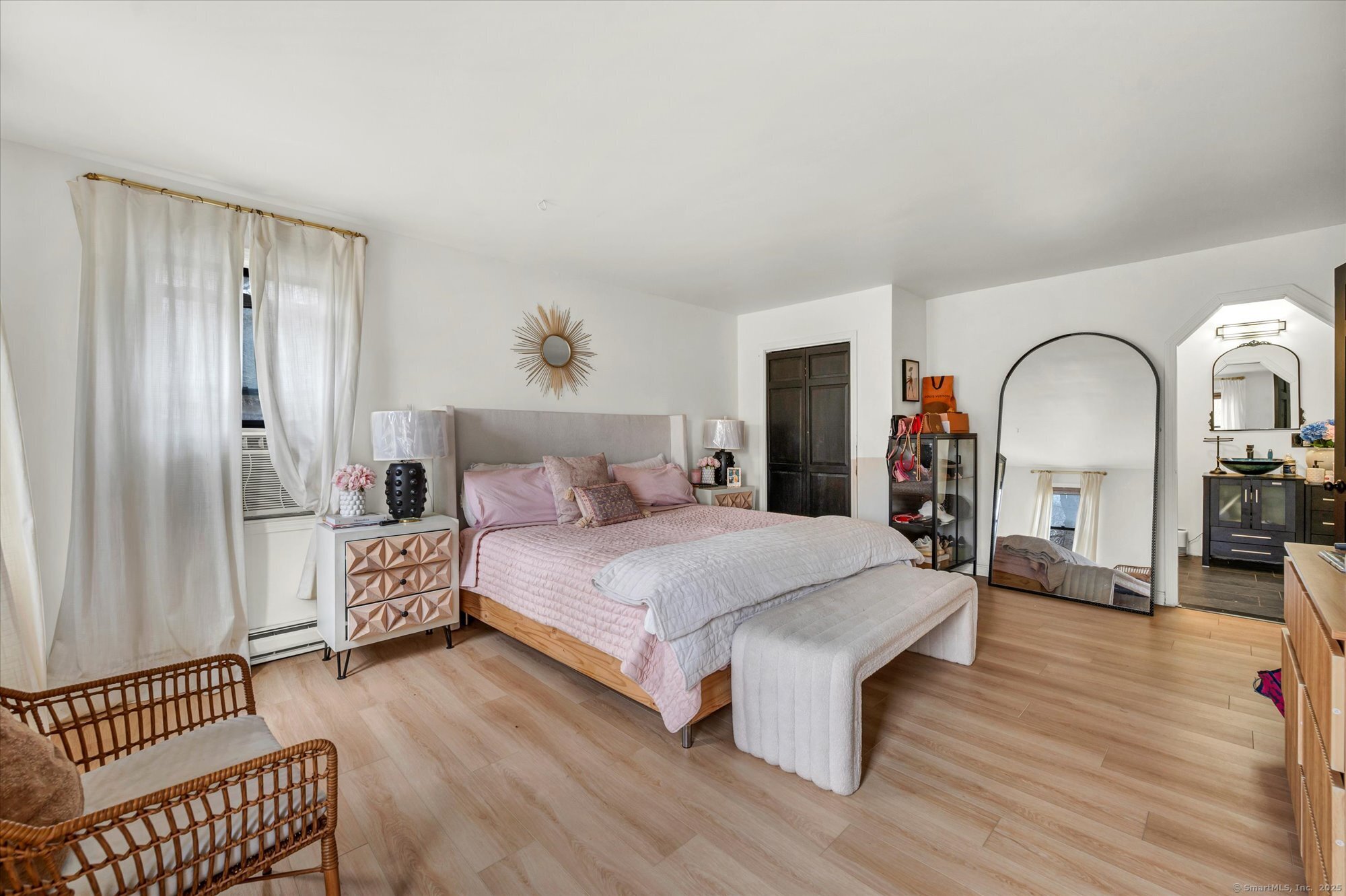 9 Katrina Circle Bethel, CT 06801 - Photo 17 of 25 a bedroom with bed and wooden floor