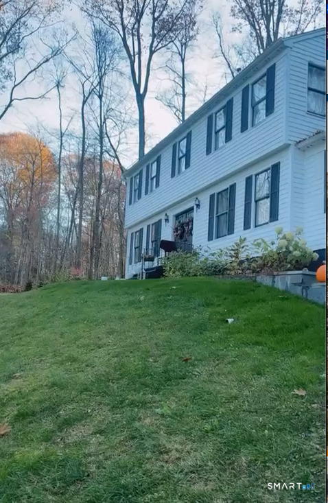 9 Katrina Circle Bethel, CT 06801 - Photo 23 of 25 a brick building with a yard in front of it
