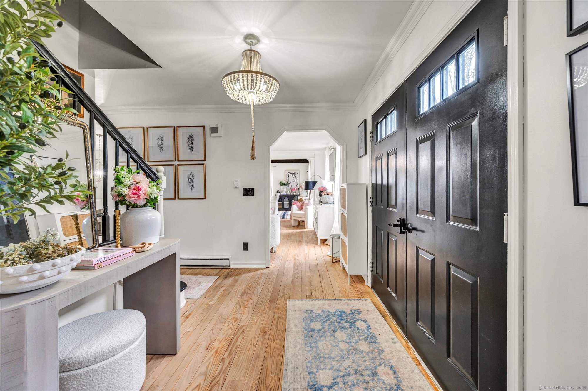 9 Katrina Circle Bethel, CT 06801 - Photo 3 of 25 a view of a hallway with furniture and chandelier