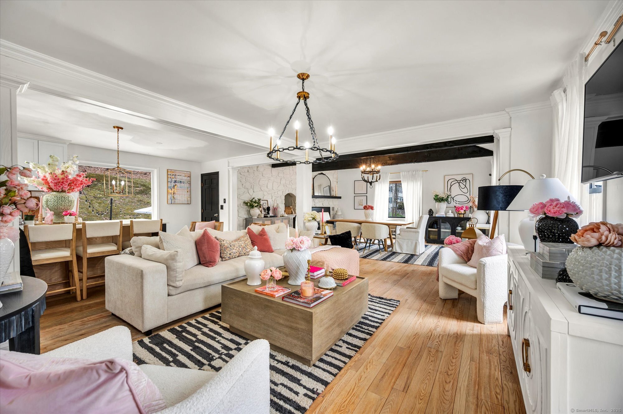 9 Katrina Circle Bethel, CT 06801 - Photo 4 of 25 a living room with lots of furniture and a chandelier