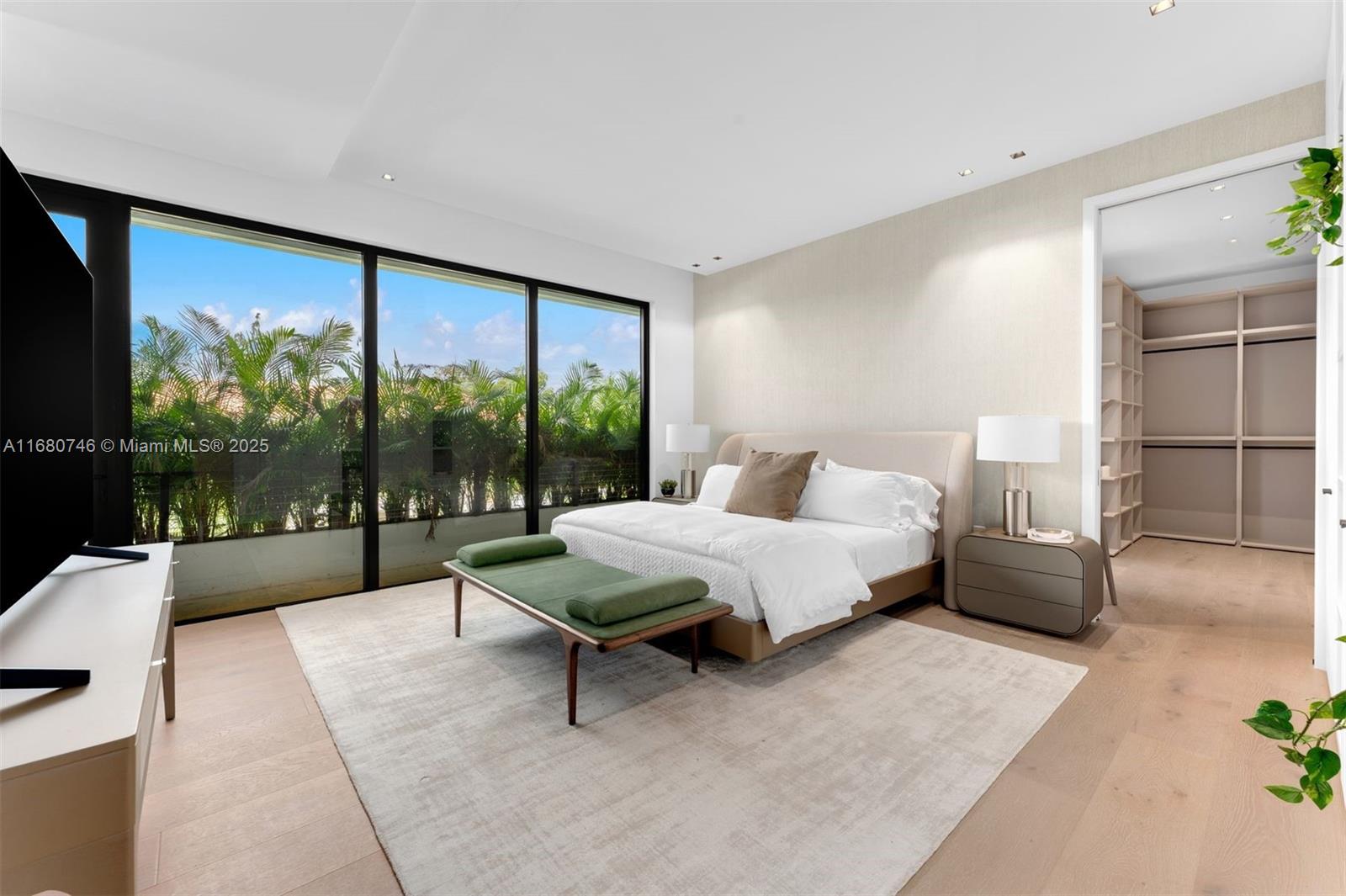 650 Warren Lane Key Biscayne, FL 33149 - Photo 21 of 34 a spacious bedroom with a large bed and a large window