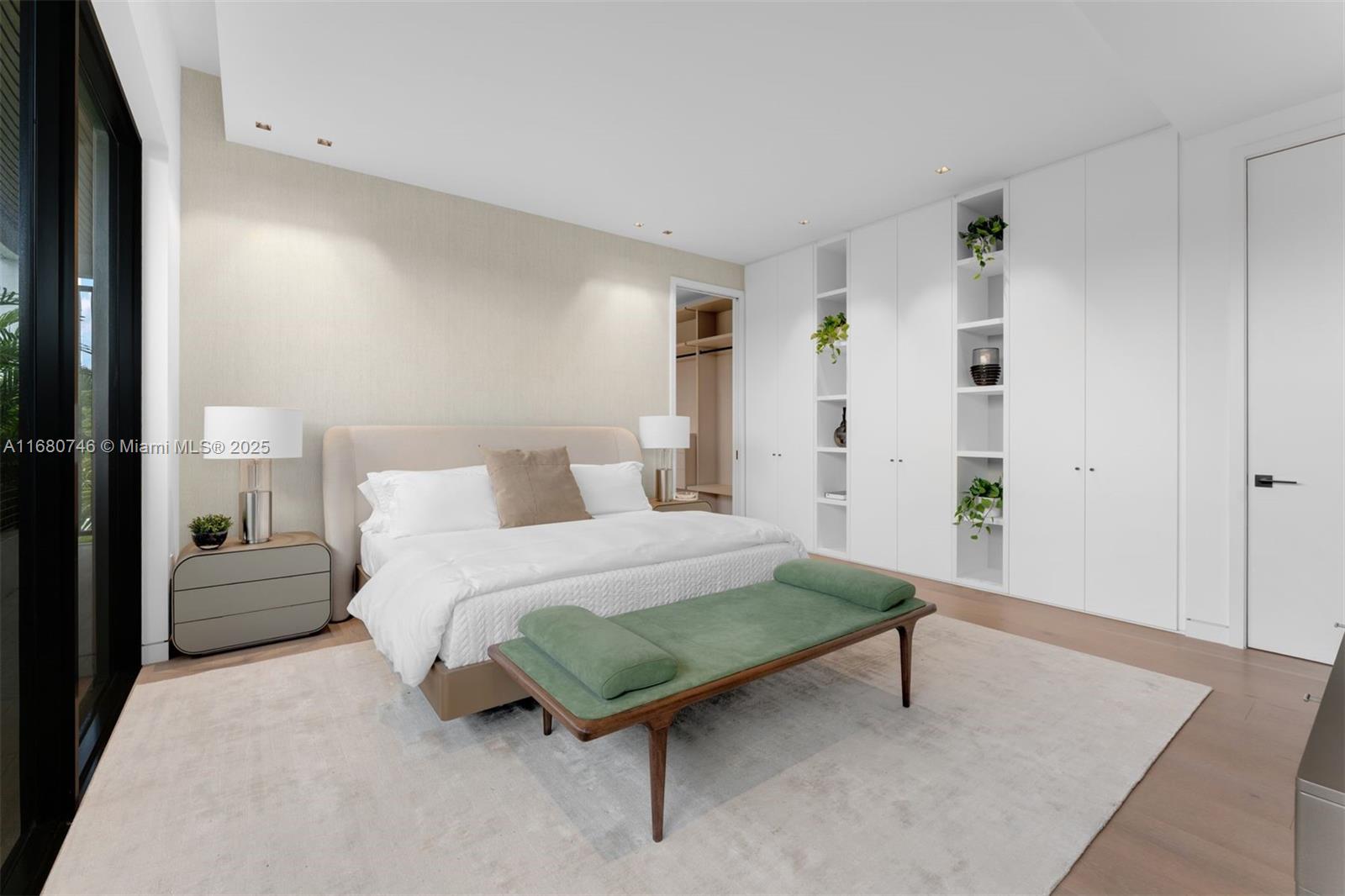 650 Warren Lane Key Biscayne, FL 33149 - Photo 22 of 34 a bedroom with a bed and a table