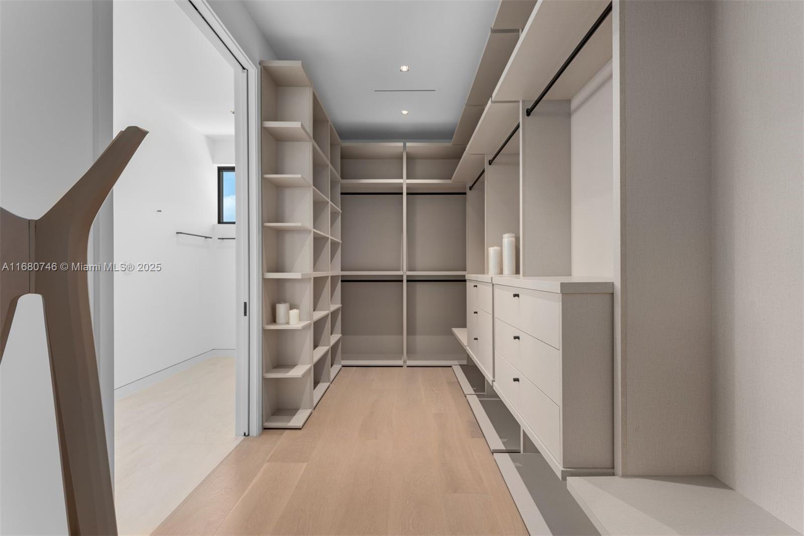 650 Warren Lane Key Biscayne, FL 33149 - Photo 25 of 34 a view of walk in closet with empty racks