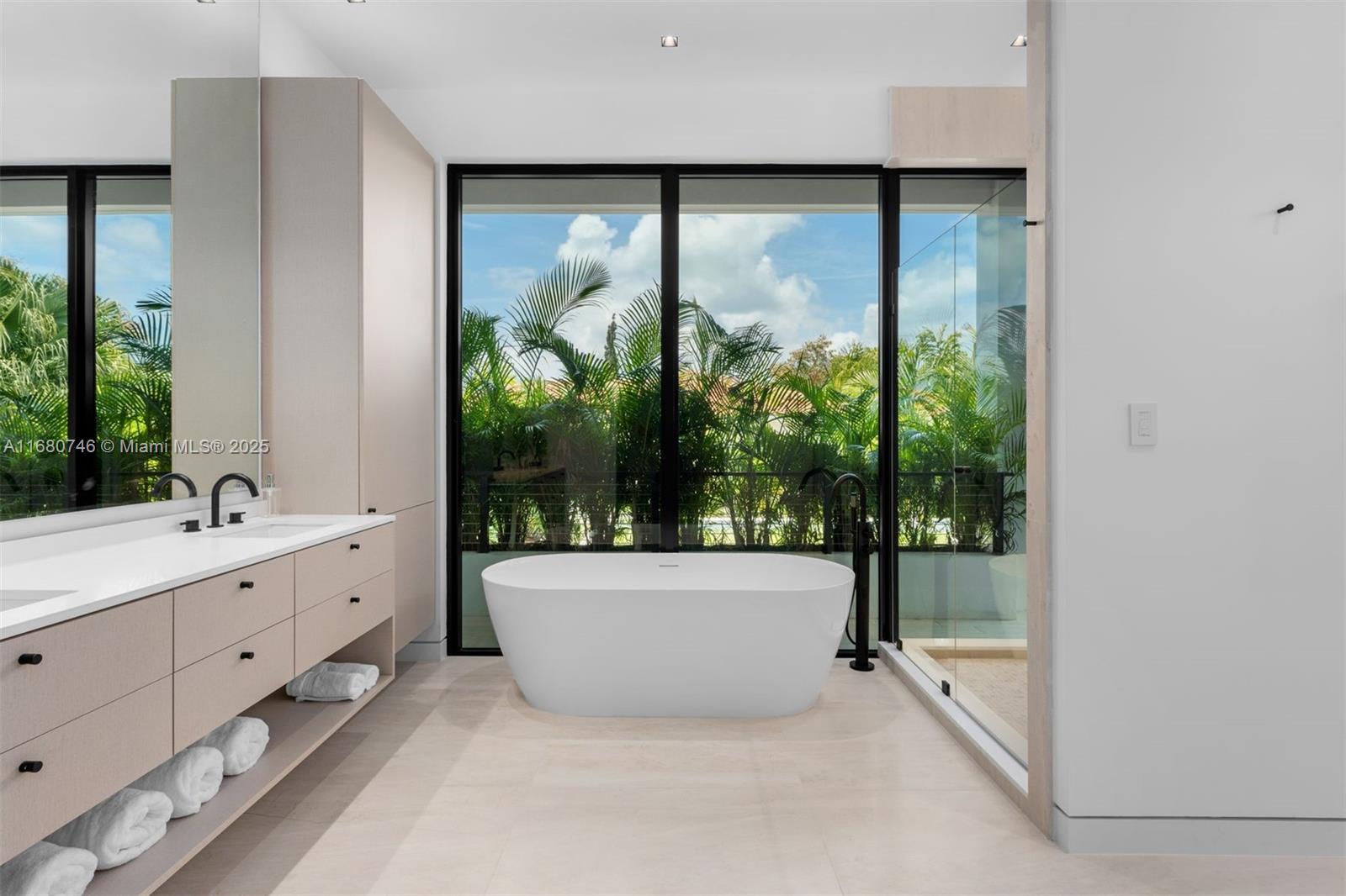 650 Warren Lane Key Biscayne, FL 33149 - Photo 26 of 34 a bathroom with a bathtub and sink