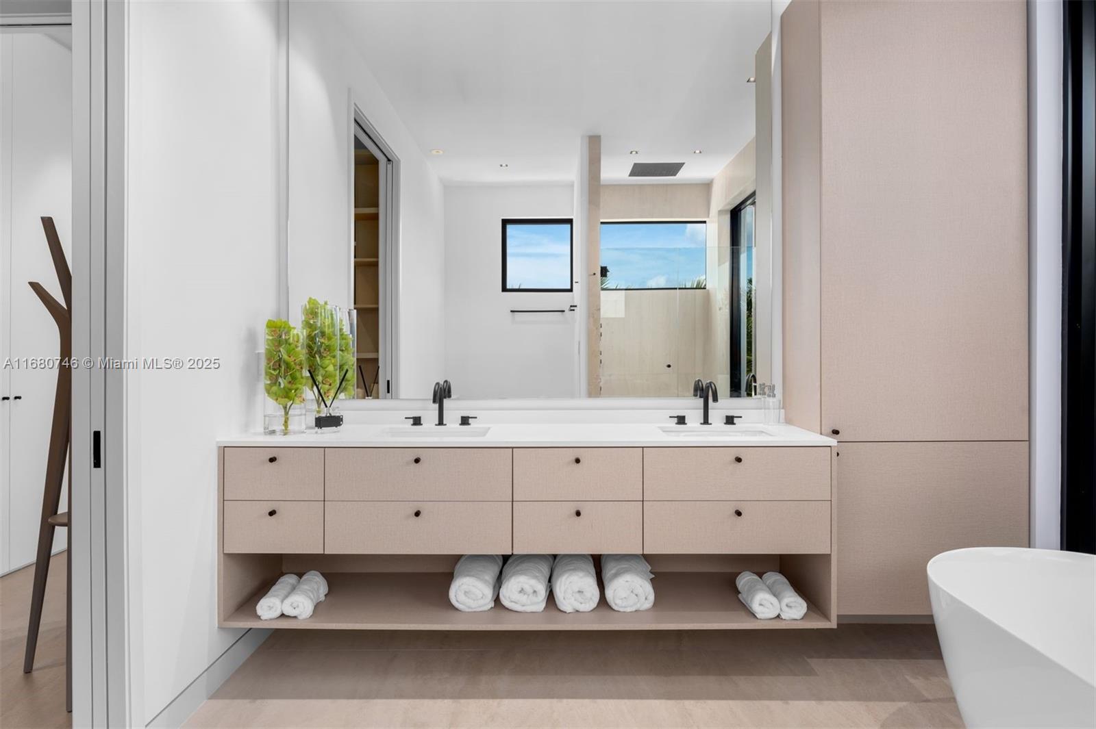 650 Warren Lane Key Biscayne, FL 33149 - Photo 27 of 34 a bathroom with a double vanity sink and mirror