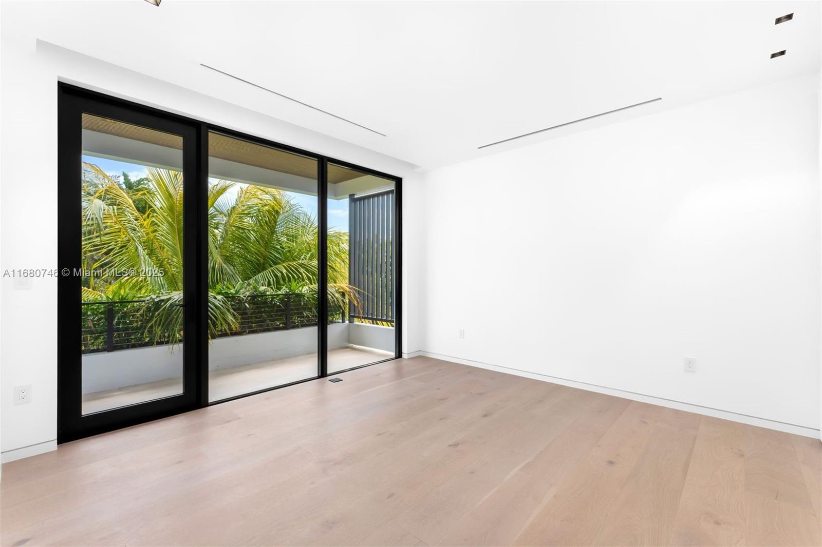 650 Warren Lane Key Biscayne, FL 33149 - Photo 29 of 34 a view of an empty room with a sliding door
