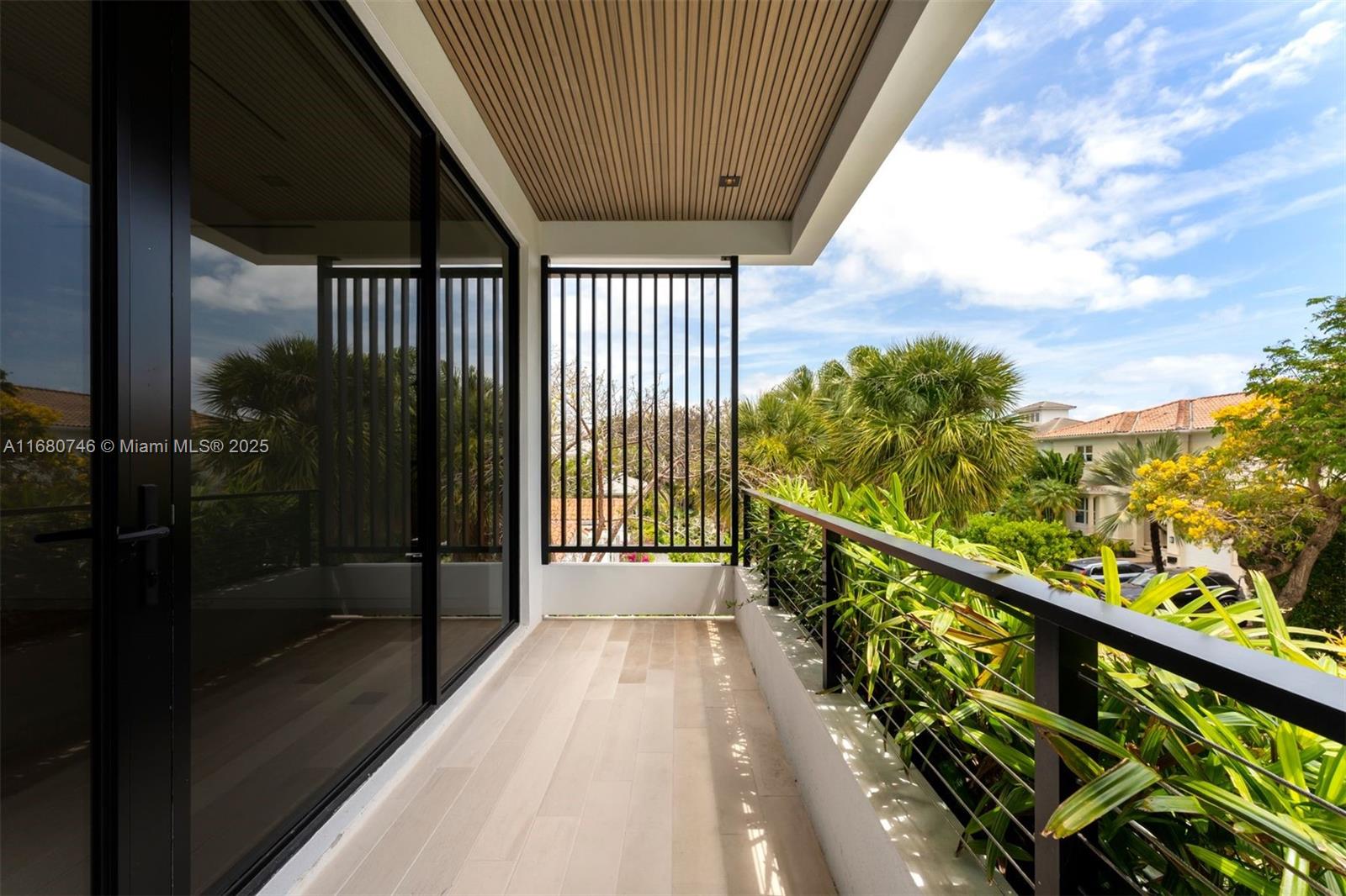 650 Warren Lane Key Biscayne, FL 33149 - Photo 31 of 34 a view of balcony with wooden floor