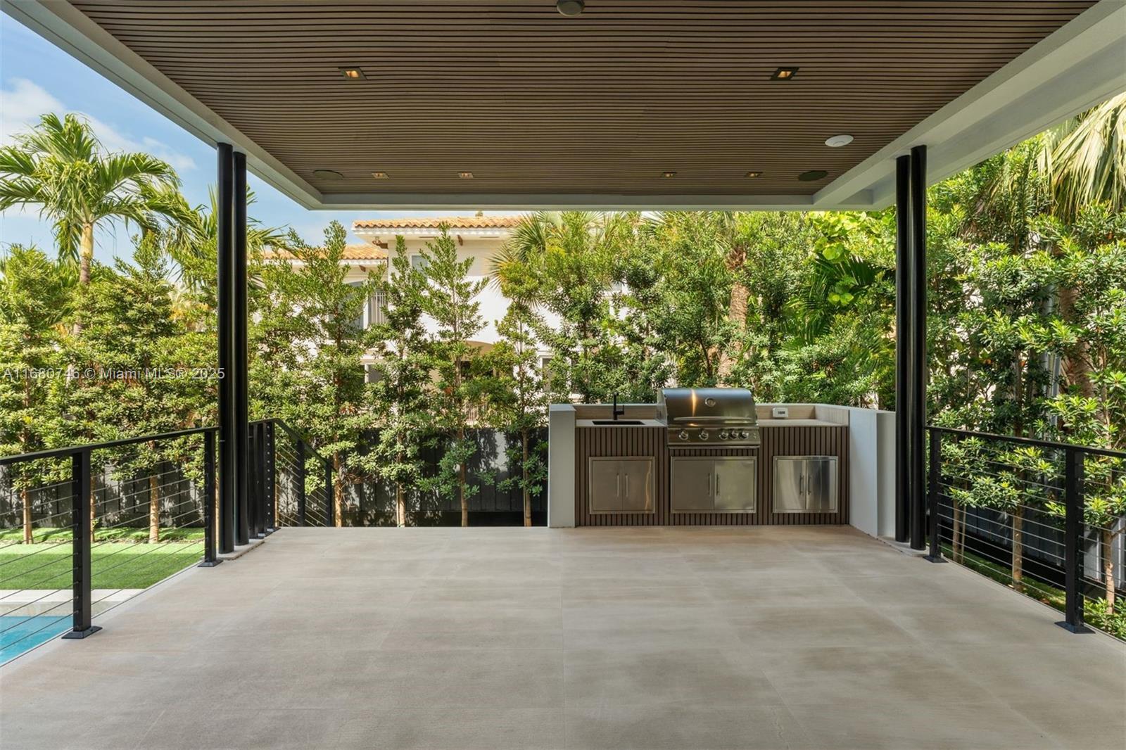 650 Warren Lane Key Biscayne, FL 33149 - Photo 6 of 34 a living room with a large window and yard