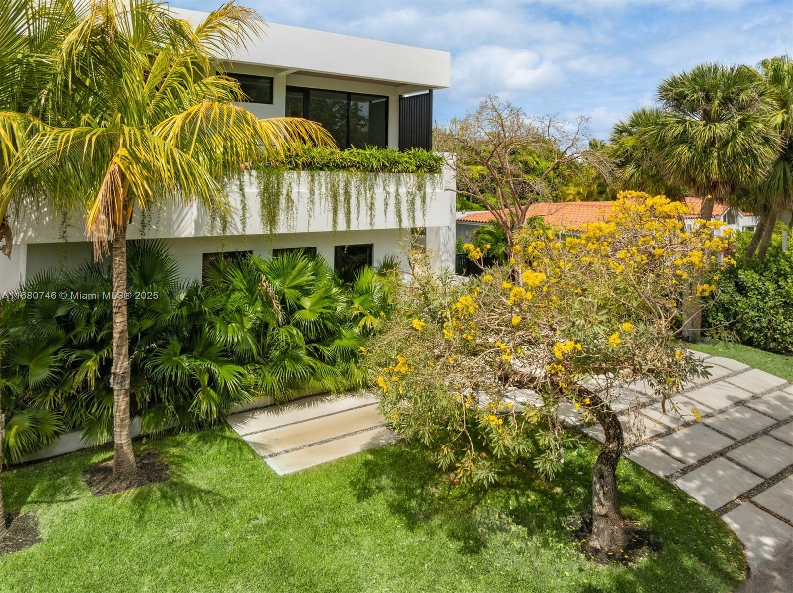 650 Warren Lane Key Biscayne, FL 33149 - Photo 10 of 34 a view of a house with a yard