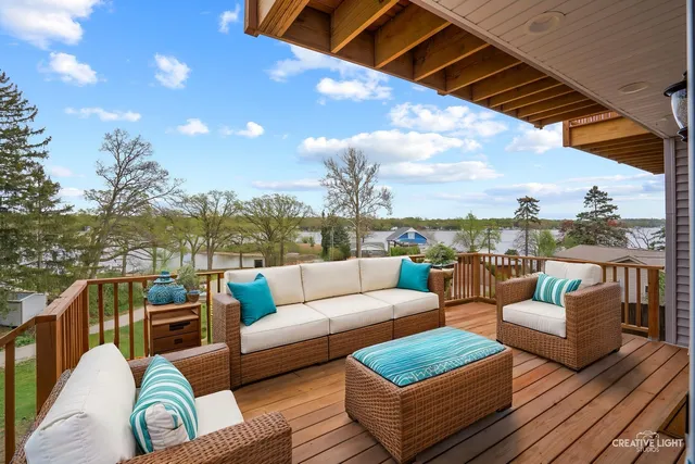 a view of couch in balcony with outdoor seating