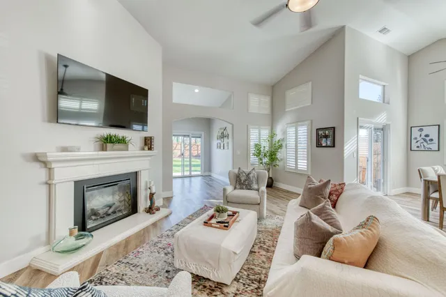 a living room with furniture and a fireplace