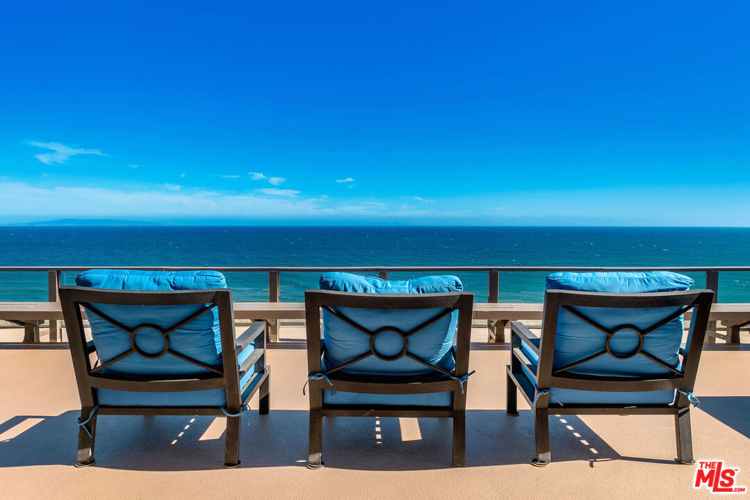 a view of chairs and table in a patio
