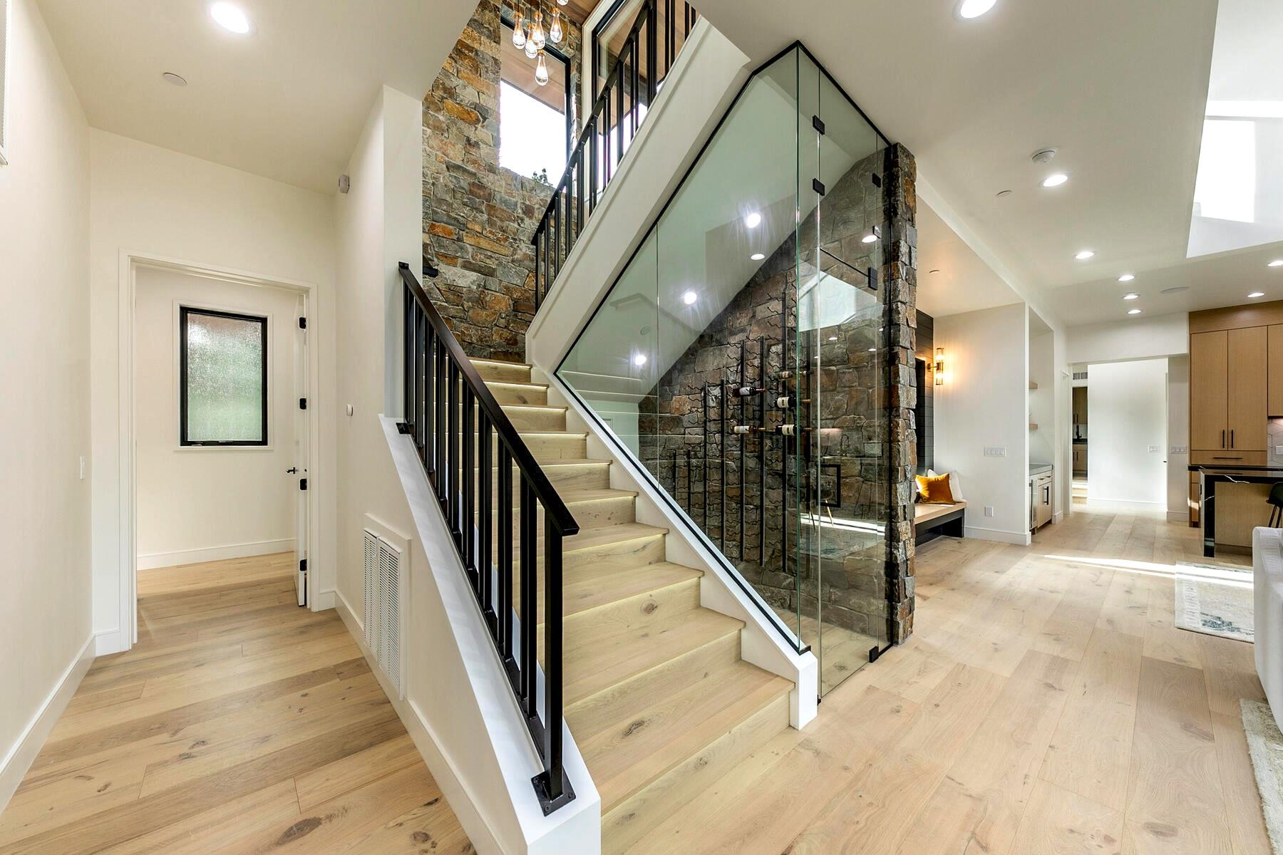 9291 Brae Road Truckee, CA 96161 - Photo 13 of 21 a view of a hallway with wooden floor and stairs