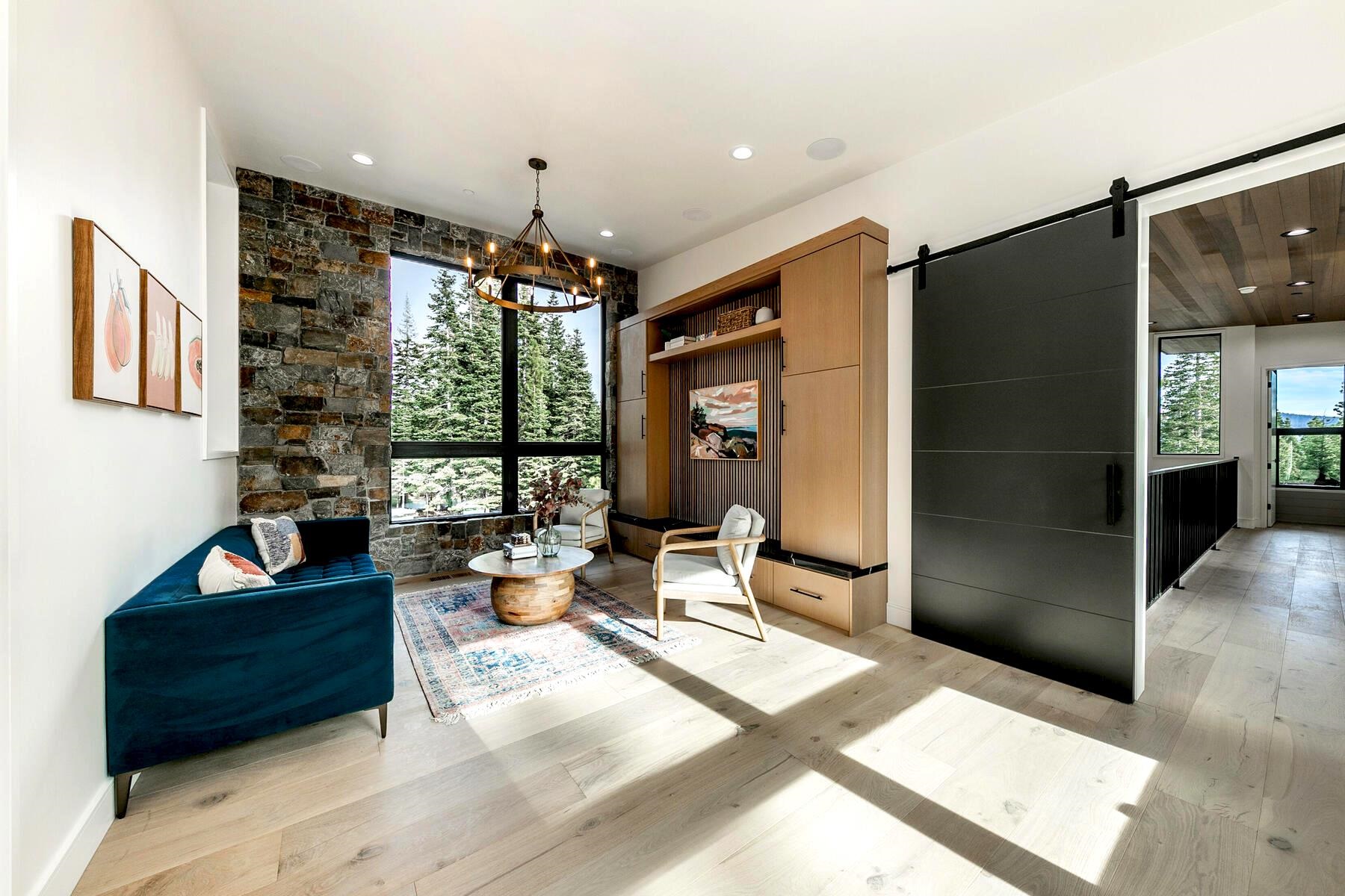 9291 Brae Road Truckee, CA 96161 - Photo 14 of 21 a living room with furniture potted plant and a large window
