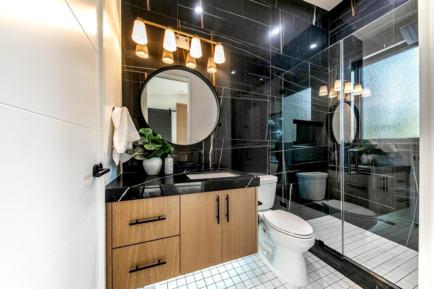 9291 Brae Road Truckee, CA 96161 - Photo 15 of 21 a bathroom with a toilet a sink and mirror