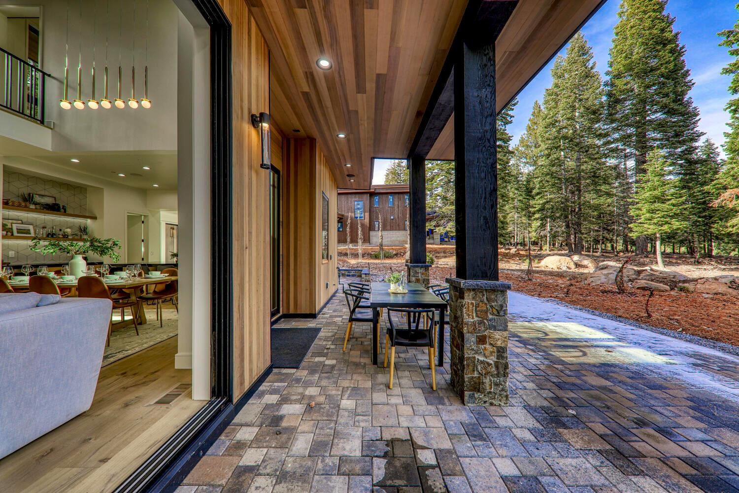 9291 Brae Road Truckee, CA 96161 - Photo 16 of 21 a view of a patio with table and chairs and potted plants